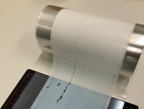 Transparent resin film showing a longitudinal surface defect