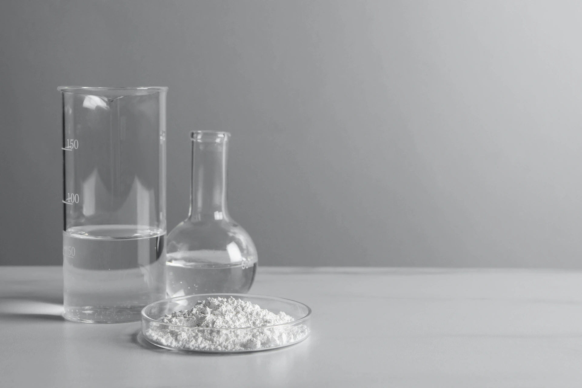 Clear liquid and white pellets suggest resin formulation testing